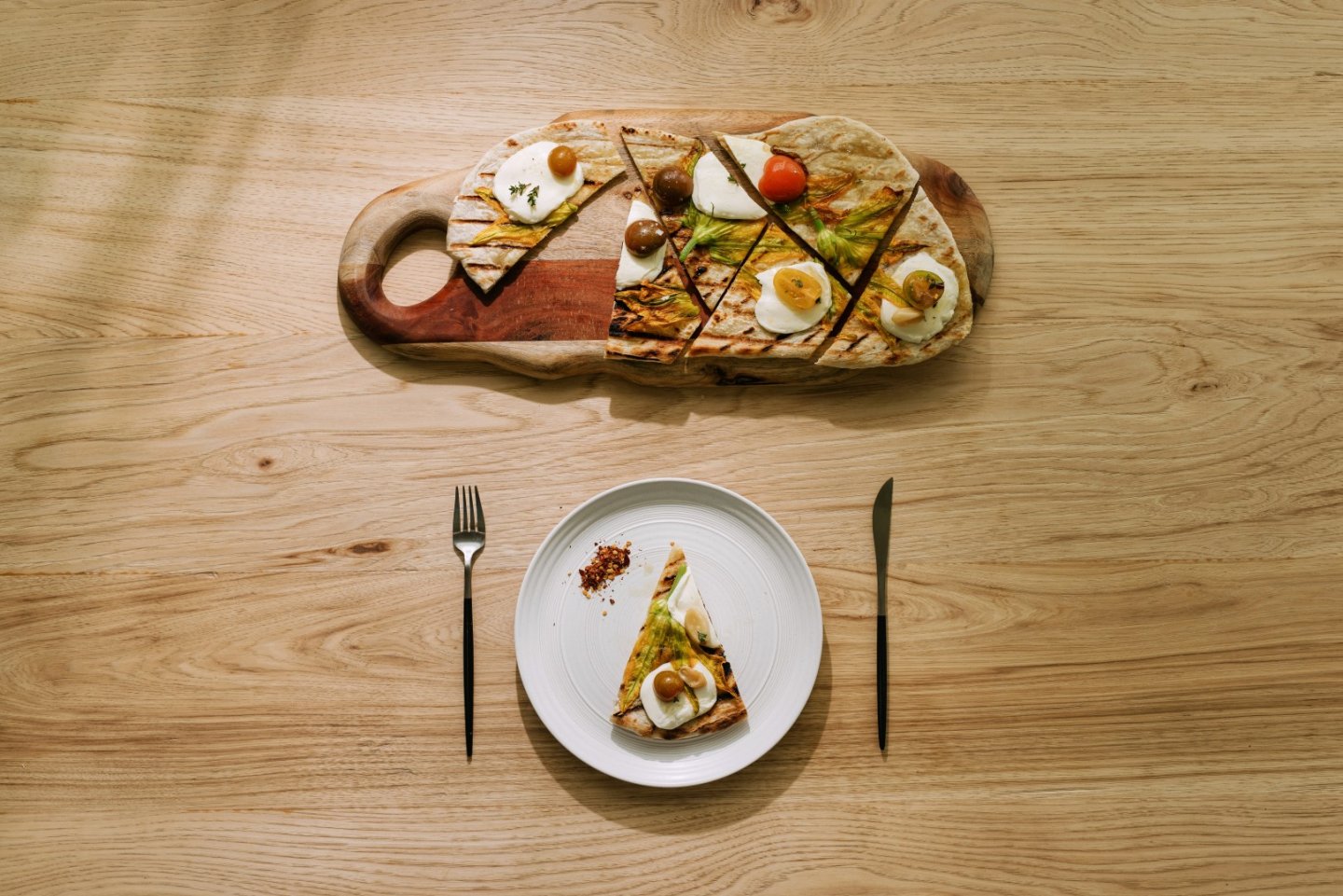 a plate of food on a wooden table.